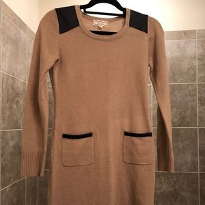 Long camel colored sweater with faux black leather